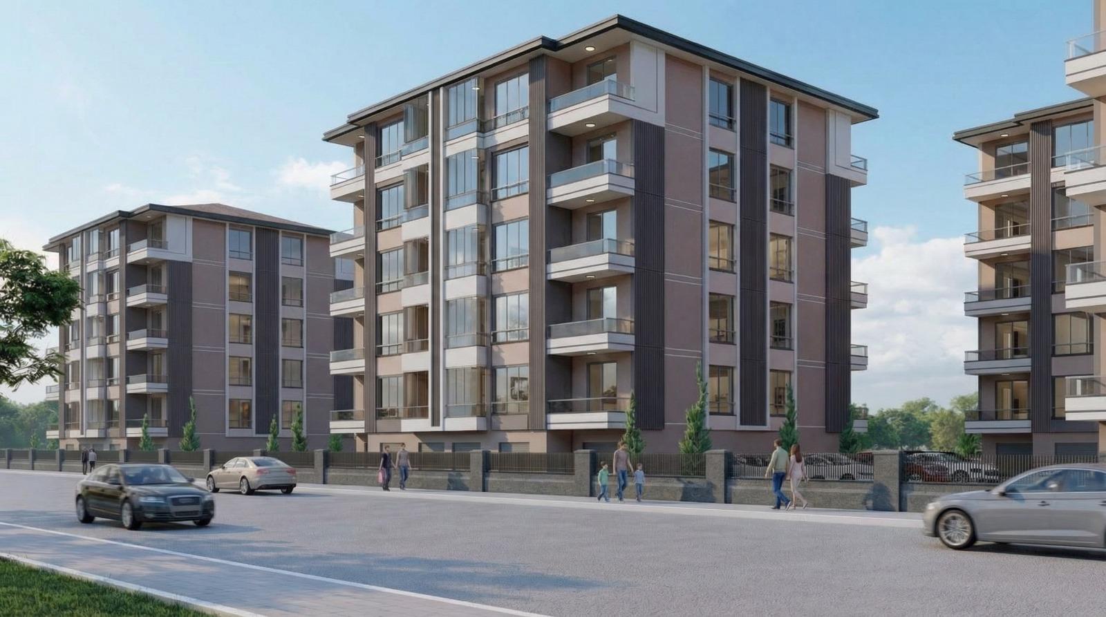 OVM Konutları modern blok mimarisi ve cadde görünümü